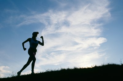 Jupiterimages/Photos.com/Getty Images Many people wear wrist weights when running to help tone their arms.
