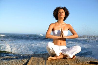 Goodshoot/Goodshoot/Getty Images Trim your waistline by breathing properly during stomach exercises.