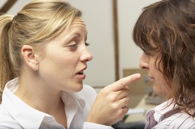BananaStock/BananaStock/Getty Images Ask your boss for help with bullying and harassing co-workers.