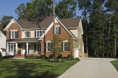Jupiterimages/Comstock/Getty Images There are several things to consider when saving money on a concrete driveway.