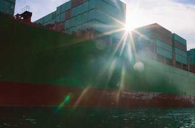 Stewart Sutton/Lifesize/Getty Images An import-export manager plans shipping and storage of goods and materials.
