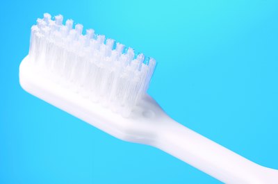 Hemera Technologies/AbleStock.com/Getty Images The standard toothbrush won't cut it for your cat.