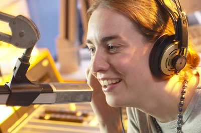 Hemera Technologies/AbleStock.com/Getty Images Podcasters earned close to the median wage for announcers.