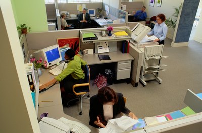 Ryan McVay/Photodisc/Getty Images Comfortable workstations can help employees remain focused and productive.
