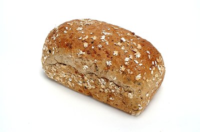 NA/Photos.com/Getty Images Increase your nutrient intake by switching to whole-grain bread.