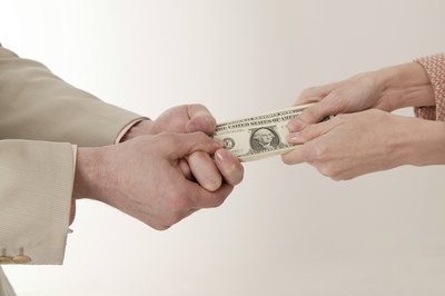 Comstock Images/Comstock/Getty Images Deciding where and how much to invest can seem like a tug of war -- with your money instead of a rope..