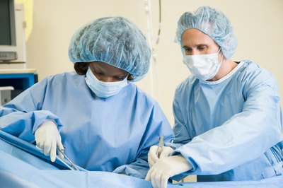 Jupiterimages/Photos.com/Getty Images New neurosurgeons learn skills by working under experienced neurosurgeons.