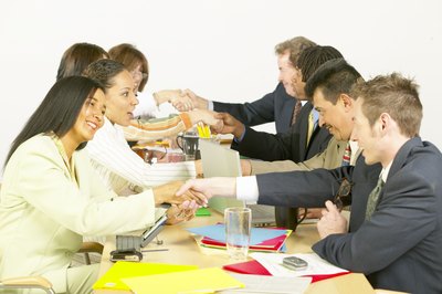 Jupiterimages/Photos.com/Getty Images Treating others with respect is a good philosophy and ethic at work.