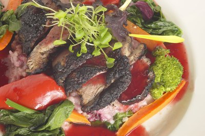 Hemera Technologies/AbleStock.com/Getty Images Limit meats to prevent high cholesterol.