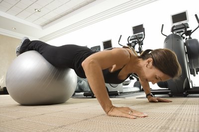 Thinkstock Images/Comstock/Getty Images Pushups work the chest and triceps