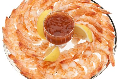 PhotoObjects.net/PhotoObjects.net/Getty Images Guppies can eat grocery store seafood as long as it's properly prepared.