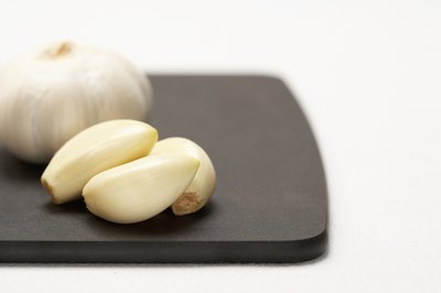 Jupiterimages/Photos.com/Getty Images A daily dose of garlic protects your health.