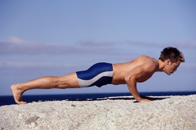 Pixland/Pixland/Getty Images You can use your body weight to tone and build muscles without added equipment.