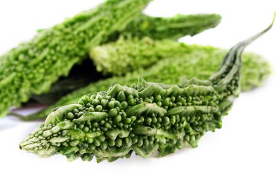 Visage/Stockbyte/Getty Images Bitter gourd contains compounds that might lower your risk of diabetes and cancer.