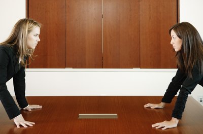 Brand X Pictures/Brand X Pictures/Getty Images Deal directly with underhanded coworkers.