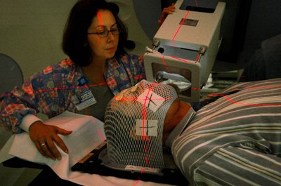 Chris Hondros/Getty Images News/Getty Images Radiation therapists apply precise dosages of ionizing radiation.