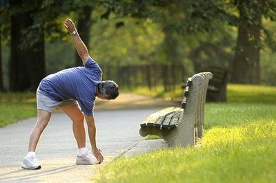 Jupiterimages/Comstock/Getty Images Simple stretches can help you start your day more energized.