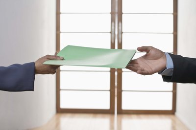 Jupiterimages/Comstock/Getty Images Maintain professional decorum in public when you receive a job offer.
