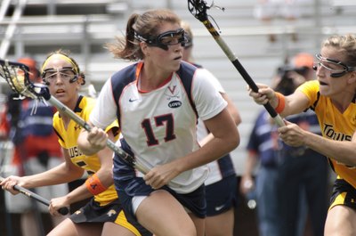 Jay Paul/Getty Images Sport/Getty Images Caroline McTierman, center, of the Virginia Cavaliers, battles two Towson Tigers.