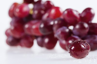 Jupiterimages/Polka Dot/Getty Images Red seedless grapes are low in calories; just don't go overboard on your serving size.