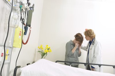 Hemera Technologies/AbleStock.com/Getty Images Heirs do not pay the debts of the deceased -- the estate does.