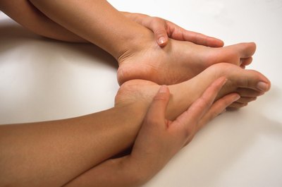 Hemera Technologies/Photos.com/Getty Images Ankle pain can cut short your yoga practice.