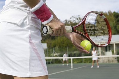 Jupiterimages/Pixland/Getty Images Sweat bands can help keep your hands blister-free.