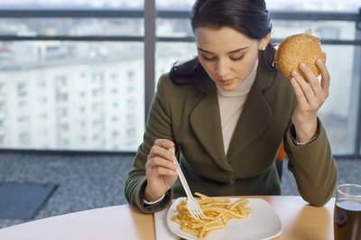 Creatas Images/Creatas/Getty Images Fast food is convenient, but not cost efficient.