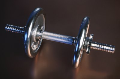 Hemera Technologies/AbleStock.com/Getty Images Snatches can be done with a barbell, dumbbell or kettlebell.