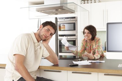 Monkey Business Images Ltd/Valueline/Getty Images Designing a household budget may lead to an animated conversation about the future.