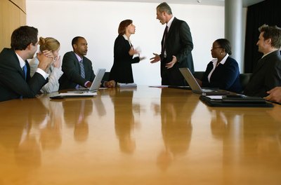 Nick White/Photodisc/Getty Images Executive conflict can lead to employee conflict if it's not brought under control.