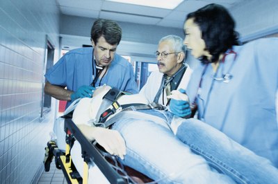 Comstock/Comstock/Getty Images ER charge nurses oversee other staff members in the emergency room.