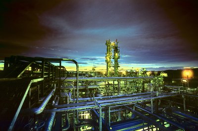 Photos.com/AbleStock.com/Getty Images Some factories operate throughout the day and night.