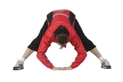 NA/PhotoObjects.net/Getty Images Stretch your legs together instead of one muscle at a time.