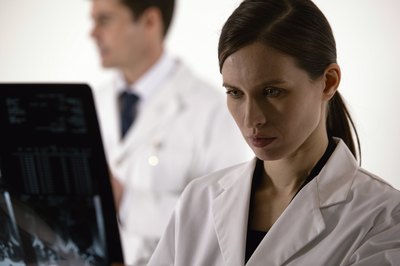 Comstock/Comstock/Getty Images Cardiologists specialize in diseases and conditions of the heart.
