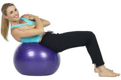PhotoObjects.net/PhotoObjects.net/Getty Images Use a stability ball to enhance your muscle-strengthening exercises.