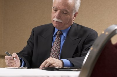 Jupiterimages/Photos.com/Getty Images A trust can frequently be terminated with a signature.