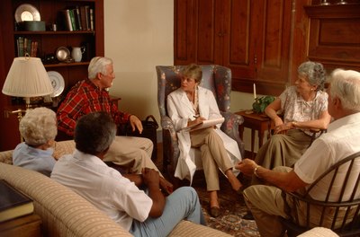 Jupiterimages/Photos.com/Getty Images Geriatric social workers provide encouragement and support to senior citizens.