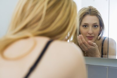 Creatas Images/Creatas/Getty Images Bikram yoga detoxifies skin; you can assist by cleansing properly.