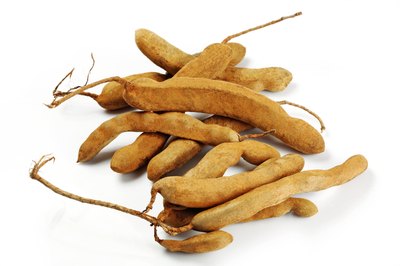 Visage/Stockbyte/Getty Images Tamarind fruit can add minerals and other essential nutrients to chutney, curries and sauces.