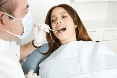 Creatas Images/Creatas/Getty Images The cost of a dental inlay depends on materials used and the tooth affected.