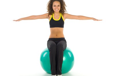 Jupiterimages/Photos.com/Getty Images Tone from head to toe with the Swiss ball.