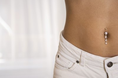 Creatas Images/Creatas/Getty Images Your stomach can be both muscular and flat.