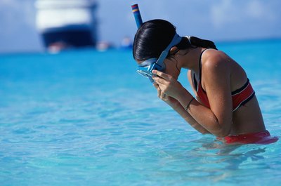 Steve Mason/Photodisc/Getty Images Swimming with a snorkeling mask can help improve your breathing technique.