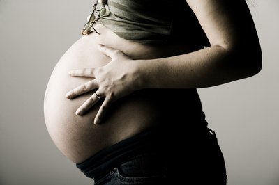 Jupiterimages/Photos.com/Getty Images An embryologist helps to increase your odds of getting and staying pregnant.