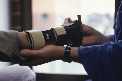 Keith Brofsky/Photodisc/Getty Images Chiropractors have a hands-on job.