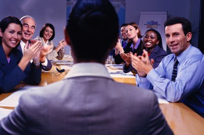 Antonio Mo/Photodisc/Getty Images Communicating respectfully helps you earn respect points, furthering your career.