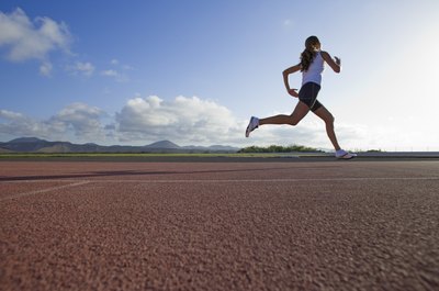 Polka Dot Images/Polka Dot/Getty Images Middle-distance runners can make great strides with the right strength training routine.