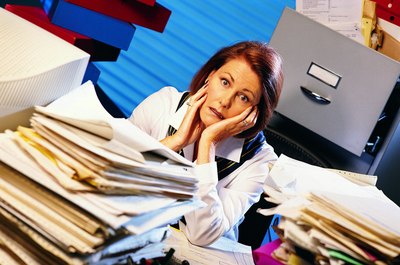 Stockbyte/Stockbyte/Getty Images Disorganization in the office can be a reflection of the state of the company.