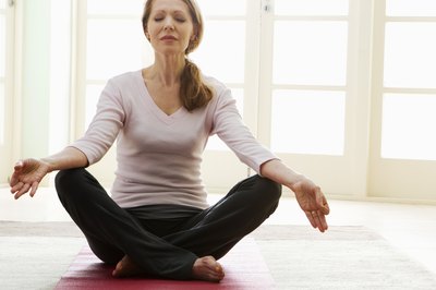 Jupiterimages/Pixland/Getty Images Including no-impact workouts, such as yoga, can improve your mood and increase your muscle tone without pain to your joints or knees.